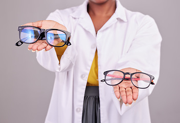 Image showing Glasses in hands, choice and vision with optometrist, prescription lens and frame isolated on studio background. Person with eyewear, ophthalmology and health insurance, product to help with eyesight