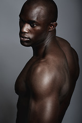 Image showing Art, aesthetic and beauty, black man on dark background with muscle and fitness, strong and serious body builder. Health, wellness and African bodybuilder or male model isolated on studio backdrop.