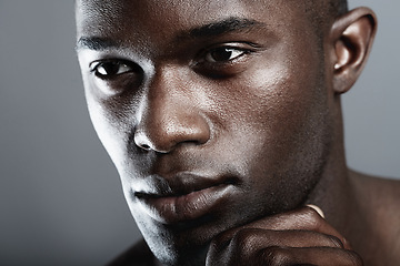 Image showing Art, beauty and serious face of black man on dark background with skin care, and dermatology. Health, wellness and male skincare cosmetics and fit, healthy African model closeup on studio backdrop.