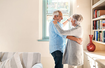 Image showing Elderly couple, dancing and home living room with smile, happiness or love for care, support or laugh. Senior man, excited old woman or dance together in house with romance, comic bonding and space