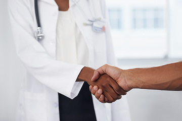 Image showing Closeup, doctor and patient with a handshake, agreement and thank you for results, healthcare and wellness. Zoom, female employee or medical professional with a male client, greeting and hand gesture