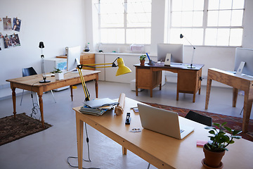 Image showing Empty office, startup or laptop on desk in workplace, company or workspace room for business. Background, modern interior design or wooden table furniture with nobody or stationary in digital agency