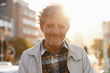 Image showing Mature, portrait and man in the city with lens flare and happiness from retirement. Sunshine, urban street and old male person face with freedom and a happy smile outdoor on holiday in New York
