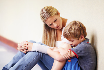 Image showing Teacher, sad student and talking at school for support, trust or counselling. A woman working with a child for discussion or education about bullying, learning problem and development in hallway