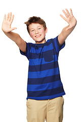 Image showing Portrait, smile and kid showing hands in studio isolated on a white background. Happy, boy and child with palms raised, fingers and counting for education, learning and mathematics for development.