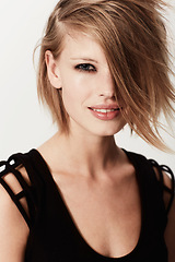 Image showing Edgy, smile and portrait of a woman with a hairstyle from salon isolated on a white background in a studio. Happy, punk and a young hair model showing a trendy, fashionable and beautiful style