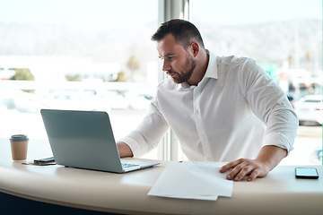 Image showing Laptop, documents and car sales man with invoice, quote and financial report for retail or transportation industry. Focus, busy and professional dealership person or boss on computer with paperwork