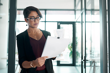 Image showing Paperwork, reading and business woman in office with data analysis, statistics report and spreadsheet review or budget. Professional worker, accountant or person with documents, accounting or taxes