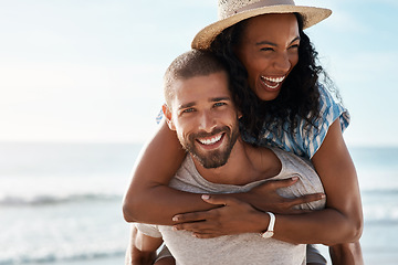 Image showing Sea, piggyback and portrait of happy couple with sky, waves and romantic summer sea holiday for travel with space. Love, man and woman at beach with mockup, adventure and vacation together on island.