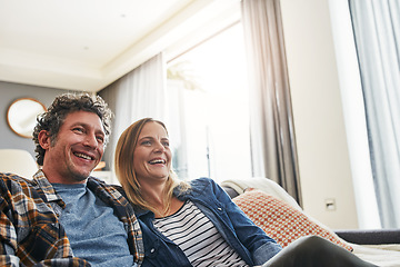 Image showing Laughing couple, relax and watching tv in home for funny movie, comedy show and media connection in lounge. Mature man, happy woman and smile for television, video subscription and streaming platform
