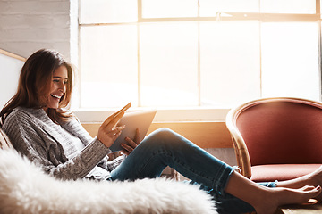 Image showing Smile, tablet and credit card with an ecommerce woman on a sofa in the living room of her home. Online shopping, finance and fintech banking with a happy young female online customer in her house