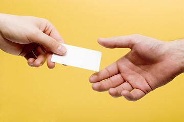 Image showing Handing a business card
