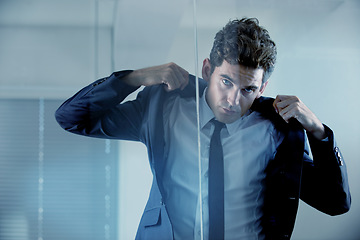 Image showing Morning, getting ready and portrait of a man in a suit for business, work and corporate job. Serious, looking and a businessman with style wearing a classy outfit for a professional executive career