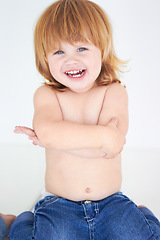 Image showing Young kid, laughing and arms crossed portrait of a toddler in studio with a smile. Ginger infant, laugh and happy in a house with joy and positivity from childhood isolated with white background