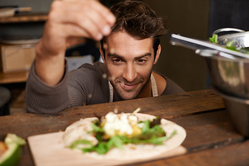 Image showing Chef, man and seasoning food in kitchen for delicious meal, healthy diet and nutrition. Cooking, sprinkle spices and male cook preparing dish for fine dining in rustic restaurant or small business.