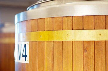 Image showing Brewery, keg and barrel for beer, alcohol and brewing process in warehouse. Wooden, drum and alcoholic beverage at a distillery for storage, fermentation and manufacturing, industry or tank system