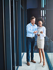 Image showing Business people with tablet, meeting and team with planning, technology and digital agenda at office. Collaboration, professional man and black woman working together with online project strategy