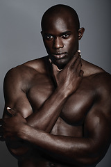 Image showing Muscle, body and skin, portrait of black man on dark background with and serious face for art aesthetic. Health, wellness and sexy, fit African bodybuilder or male model isolated on studio backdrop