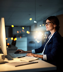 Image showing Businesswoman, desktop and focus at night or employee in the office or reading emails on bokeh. Corporate, dark and female manager or contemplate or research on pc in the evening and at workplace