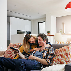 Image showing Happy couple, tv and hug to watch movies, news and cable show for media entertainment on lounge sofa. Mature man, woman and relax with television remote, subscription and smile for streaming service