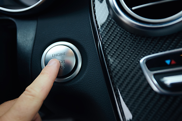 Image showing Car driver starting the engine. Shallow dof.