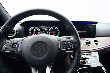 Image showing Control buttons on steering wheel. Car interior.