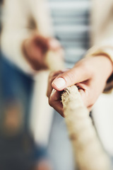 Image showing Closeup of hand, rope and tug of war for team building, business people and collaboration with competition. Corporate conflict resolution, challenge and teamwork with employees in workplace