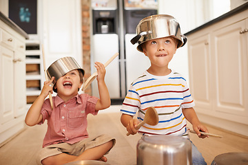 Image showing Smile, pots and playing with children in kitchen for imagination, fantasy and games. Bonding, siblings and happy with kids and kitchenware on floor of family home for music, noise and happiness