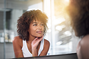 Image showing Skincare, woman and bathroom mirror face check after cometic, treatment and cleaning in her home. Beauty, glow and female touching her skin after facial, grooming and smile with results satisfaction