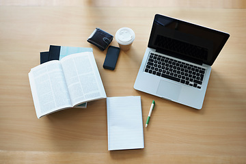 Image showing Top view, notebooks and laptop with study equipment, resources and smartphone with connection. Book, computer and cellphone with coffee, wallet and planning with software, website and online tool