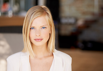 Image showing Face, young serious woman at her office and in a blurred background. Portrait of confident or proud person, corporate manager or worker and closeup of female professional with focus in Denmark