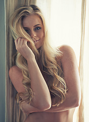 Image showing Sexy, window and woman in portrait with body for nude confidence, freedom and self love in her home or bedroom. Young blonde model or person with hair in face and naked with alluring beauty