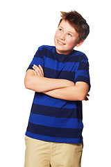 Image showing Thinking, happy and a child with arms crossed and looking up isolated on a white background in a studio. Smile, contemplation and a young boy with happiness, confidence and pride in fashion clothes