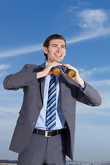 Image showing Binoculars, happy and search for business man outdoor with happiness, smile and investigation. Future, searching and businessman in nature with investigate gear and opportunity vision ready for work