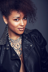 Image showing Fashion, style and beauty portrait of woman in studio for trendy clothes, leather jacket or jewellery. Face of African female model with makeup, cosmetic and punk or rock aesthetic on grey background