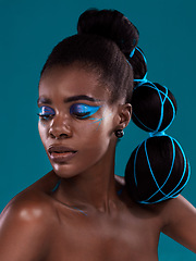 Image showing Thinking, beauty and makeup with a model black woman in studio on a blue background for hair or trendy fashion. Face, cosmetics and idea with an attractive young female person posing for haircare