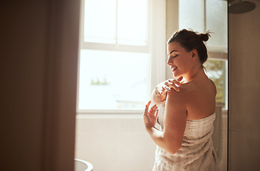 Image showing Skincare, cream and woman in bathroom for body wellness, moisturizer and apply lotion for healthy skin. Beauty, self care and female person for grooming, shower and cosmetics for hygiene at home