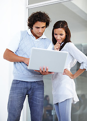 Image showing Office man, woman and laptop sharing ideas in meeting for planning or information at workplace. Happy business people in creative project plan on computer research, strategy or teamwork for startup