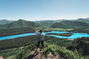 Image showing Woman taking photo in mountain