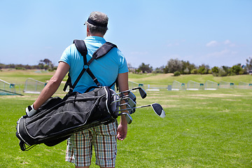 Image showing Golf course, staff bag and rear view of senior man outdoors for training, sports and exercise routine. Behind, golfing and elderly male golfer at a park for retirement, hobby and sports practice