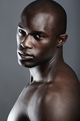 Image showing Beauty, serious portrait of black man and studio background with muscle fitness and skin glow aesthetic. Health, wellness and face of sexy African bodybuilder or male model isolated on grey backdrop.