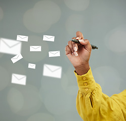 Image showing Woman, hands and writing with email icons for communication, advertising or marketing on mockup. Hand of female person holding pen with envelopes for planning, networking or online notes on space