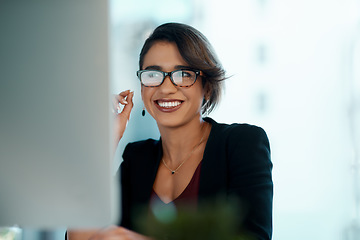 Image showing Business woman, happy and computer in glasses reflection for reading, online review and editor analysis or news. Smile of biracial person or professional worker with website or results on desktop pc