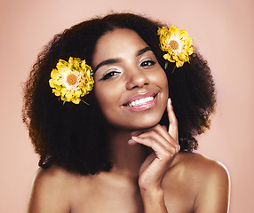 Image showing Portrait face of happy woman, afro and flowers in studio background for beauty, floral aesthetic and shine. African model, natural skincare and daisy plants in hair for makeup, cosmetics and perfume