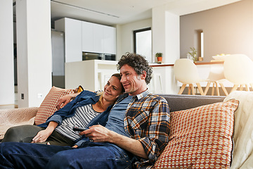 Image showing Happy couple, relax and watching tv on living room sofa for news, cable show and media connection at home. Mature man, woman and hug with television remote, video subscription and streaming platform