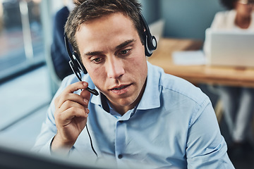 Image showing Businessman, call center and consulting with headphones in customer support, service or telemarketing at office. Man employee consultant or agent talking on PC for online advice or help in contact us