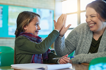 Image showing High five, student and teacher happy to help with work, study and learning math in classroom and girl, education, book and pen. Child, success and achievement in school or helping, woman and support