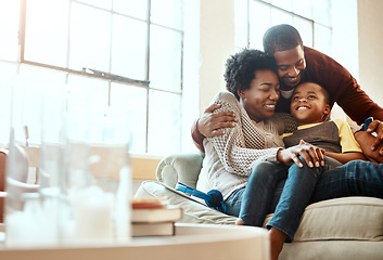 Image showing Smile, relax and family hugging on a sofa together in the living room of their modern house. Happy, love and African mother and father bonding, embracing and resting with their boy child at home.