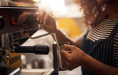 Image showing Coffee machine, hands and barista steam milk in cafe for latte, espresso and cappuccino drinks. Closeup of waitress, jug and hot beverage for heating in caffeine process, restaurant service and store