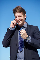 Image showing Business, phone call and man with fist for celebration outdoors with good news, success and promotion. Smartphone, conversation and male boss with winning hand gesture for startup, loan or approval